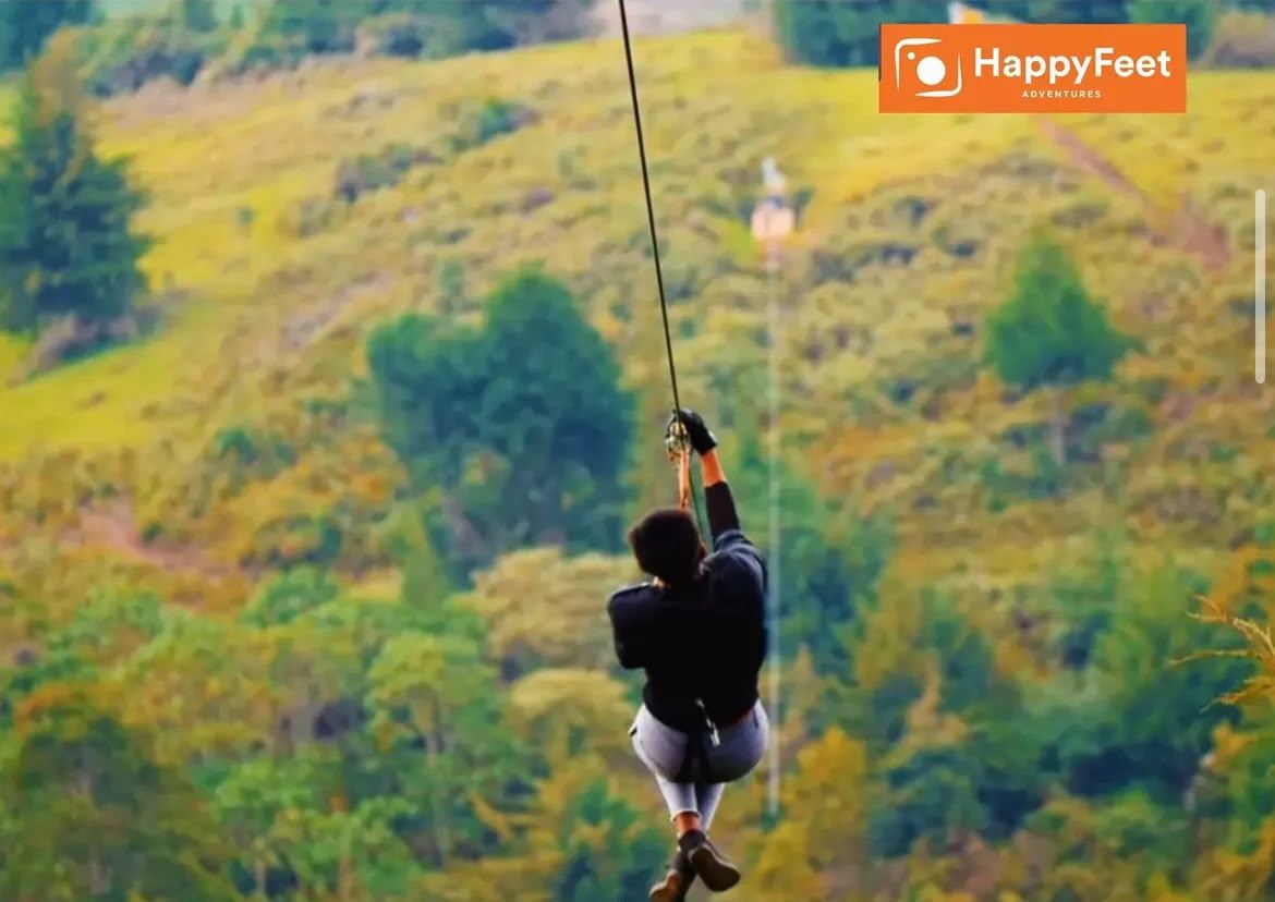 Zip-lining over a green valley